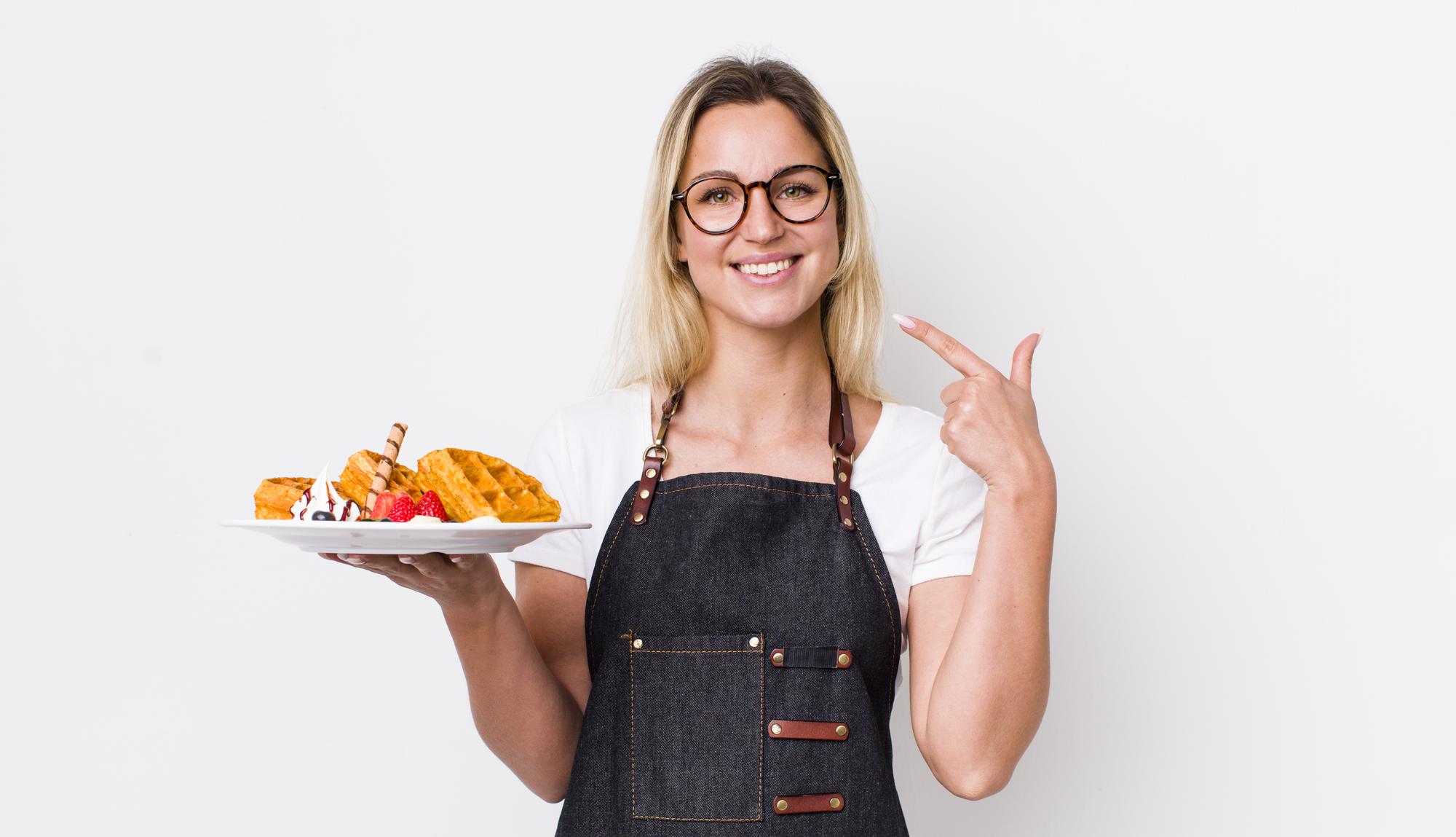 Friendly chef offering a plated sample
